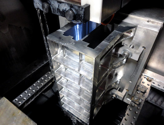 Wire EDM machine cutting an intricate metal part